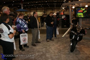 Checking out the Buell 1125R: The crowd gawks at the Buell 1125R.